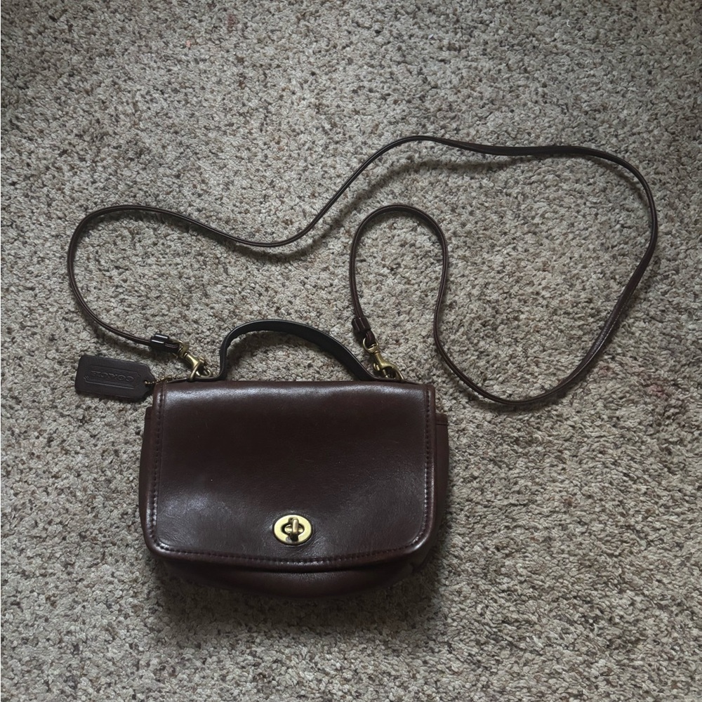 brown coach vintage casino cross body leather bag with gold accents